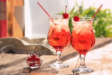 Glasses with tequila cocktails on wooden table