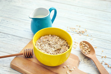 Nutritious oatmeal for breakfast on wooden table