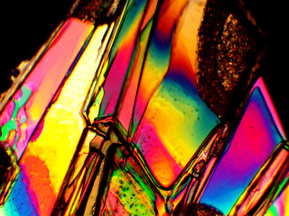 Crystals seen in a microscope, using polarized light.