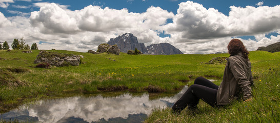 Woman is relaxing at Dolomites