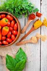 Spices and beautiful, fresh, bright vegetables on the table