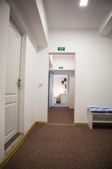 Hall with many doors.