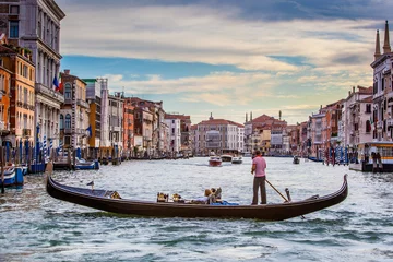 Fotobehang Gondels Men In Gondola On Canal In City Against Sky, Venice, Italy