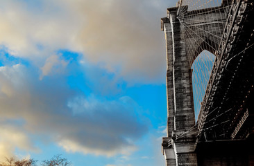 Fototapeta na wymiar Stars and stripes flying on Brooklyn Bridge