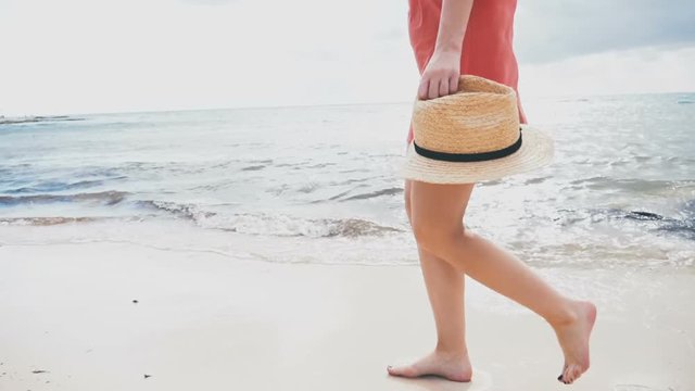 Girl in a red dress is walking on the water