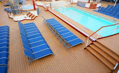 Blue Deck Chairs neatly placed on a Ship Deck