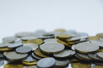 Heaps Of Coins Over White Background