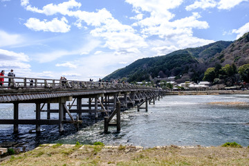 Kyoto, Japan - March, 29 2017 : Tourist in Togetsukyo bridge with Cloudy and sky, Arashiyama Japan