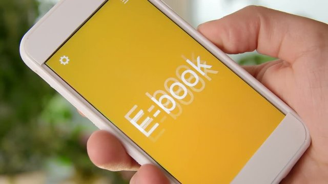 E-book concept application on the smartphone. Man uses mobile app.