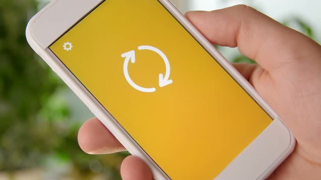 Web Hosting concept application on the smartphone. Man uses mobile app.