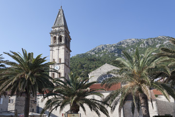 Fototapeta na wymiar 55 meter high bell tower of St. Nicholas Church - the highest on the coast of Kotor Bay