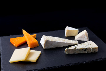 cheese appetizer on black background