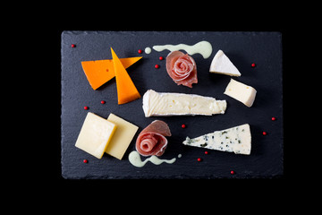 cheese appetizer on black background