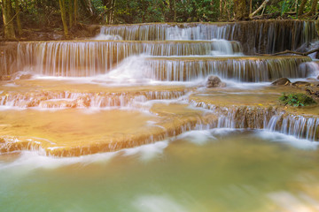 Fototapeta premium Natural multiple layers stream waterfall in tropical national park of Thailand, natural landscape background