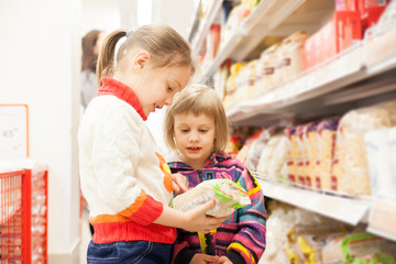 children in   store at   shelves with products.