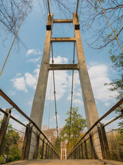 suspension bridge across Kwai river connect the other side for watching Sai Yok Yai waterfall