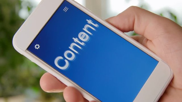 Content concept application on the smartphone. Man uses mobile app.