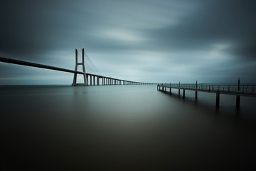 Fototapeta na wymiar vasco da gama bridge in lisbon on a cloudy day