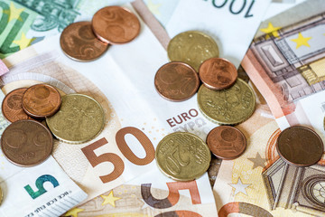 savings Cash money concept euro banknotes all sizes and cent coins on desk