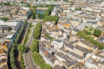 Aerial cityscape view with beautiful buildings and wide avenue in Nantes city during the sunny weather in France