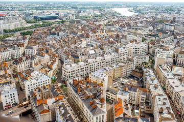 Fototapeta premium Aerial cityscape view with beautiful buildings and in Nantes city during the sunny weather in France
