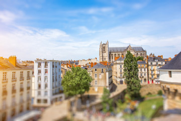 Naklejka na ściany i meble Beautiful cityscape view with saint Pierre cathedral and castle walls in Nantes city during the sunny day in France