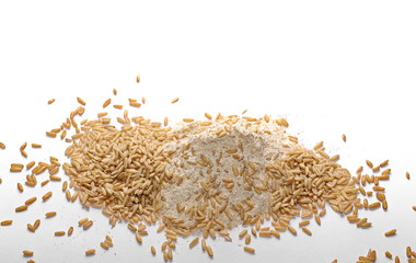 pile whole grain barley flour and oats isolated on white background
