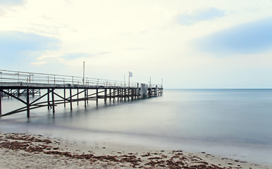 Fototapeta premium The Black Sea shore from Albena, Bulgaria with golden sands, sun, blue mystic water, seaside bridge near Kaliakra hotel