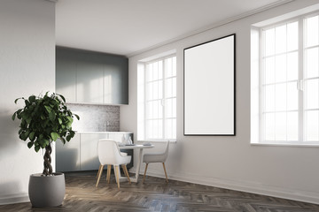 White kitchen with a poster, gray countertops