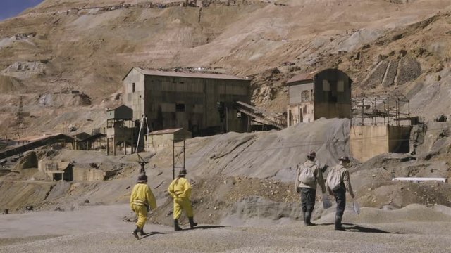 Group of miners returning to work after a meal break. Old mining installation in Potosi, Bolivia