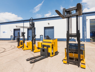 london, england, 10/05/ 2016 Big vivid yellow modern pedestrian forklift machines. Pedestrian counterbalanced stackers and Heavy duty industrial powered pedestrian stackers. © dannyburn