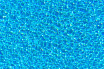 Blue rippled water in swimming pool
