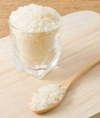 Japanese Rice in A Wooden Spoon and Glass Cup