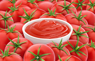 Tomato ketchup on tomatoes background. Red tomato texture.