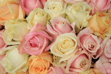 Pastel roses in a wedding arrangement