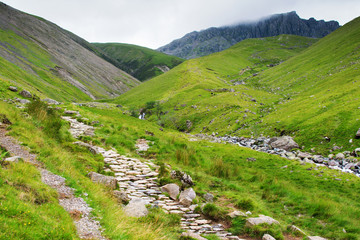 Lake District National Park, path to Scafell Pike, view of the mountains, stream, England, selective focus