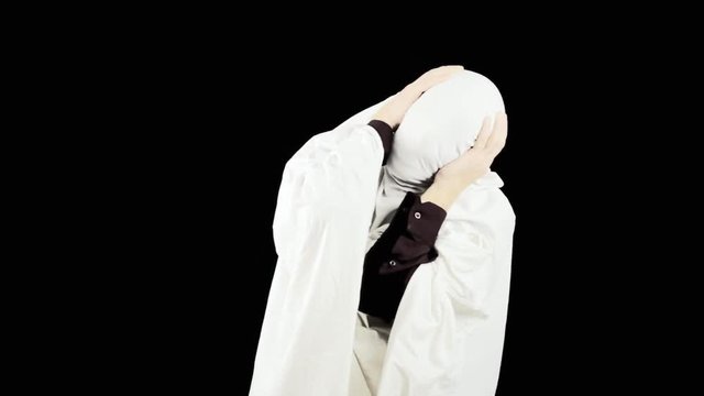A tormented man hiding under a blanket. Symbolic shot: guilt trap, shame, sin, stigma, suffering, pain. Redux.
