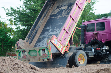.Dump truck to soil to improve the soil. For construction