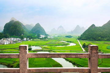 Fototapeta premium Stunning rice field view with karst formations China