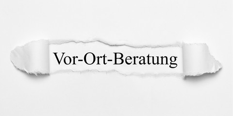 Obraz premium Vor-Ort-Beratung auf weißen gerissenen Papier