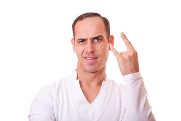 portrait of a young man in white background showing a sign of rock  and  roll