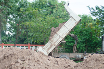 .Dump truck to soil to improve the soil. For construction