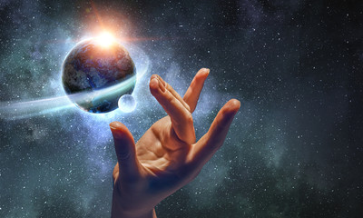 Touching planet with finger