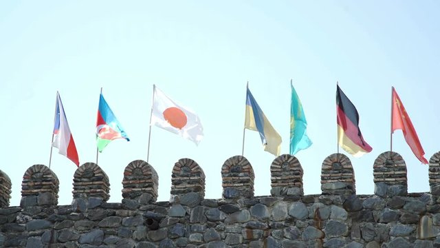 Czech Azerbaijani Japanese Ukrainian Kazakh German Chinese Flags on fortress wall