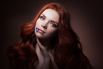 awesome girl with  a flower in her mouth