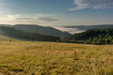 Belgian countryside - Ardennes. View over the Semois valley covered by clouds in the Belgian Ardennes in the morning.