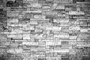Puzzle brick grunge texture wall background. Haunt and horror. Rough and mess. Dark vignette. Black and white colors. Close up.