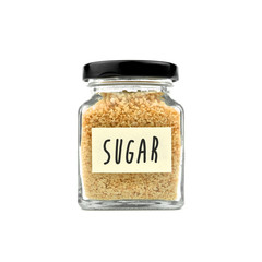 Brown sugar in a glass bottle isolated on white background. Granulated sugar, with word 