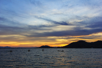 Naklejka na ściany i meble View of Songkhla lake during sunset at Songkhla province, Thailand