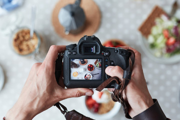 Professional food-photographer making shot of food for advert